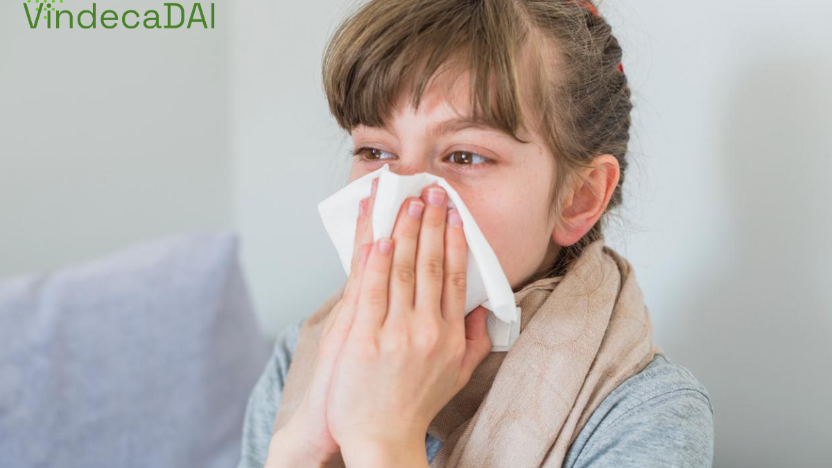 Fetita care isi sufla nasucul